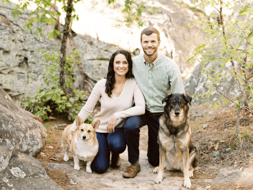 Dalton Strong poses with a woman and two dogs for a fun family photo.